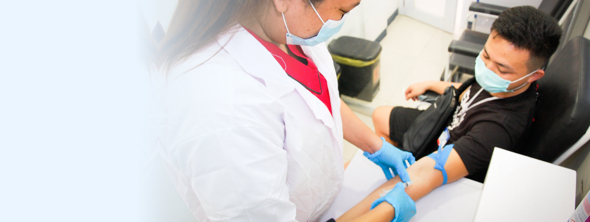 nurse taking blood of the patient