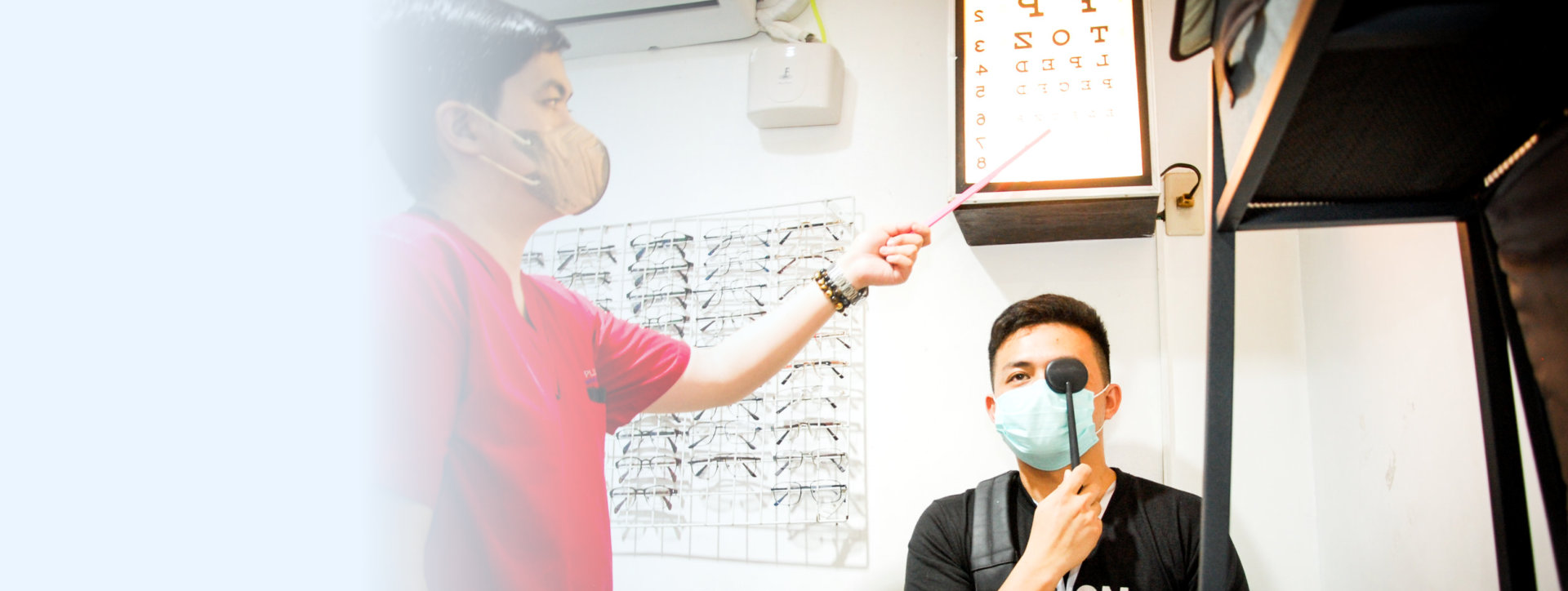 nurse testing the patients vision