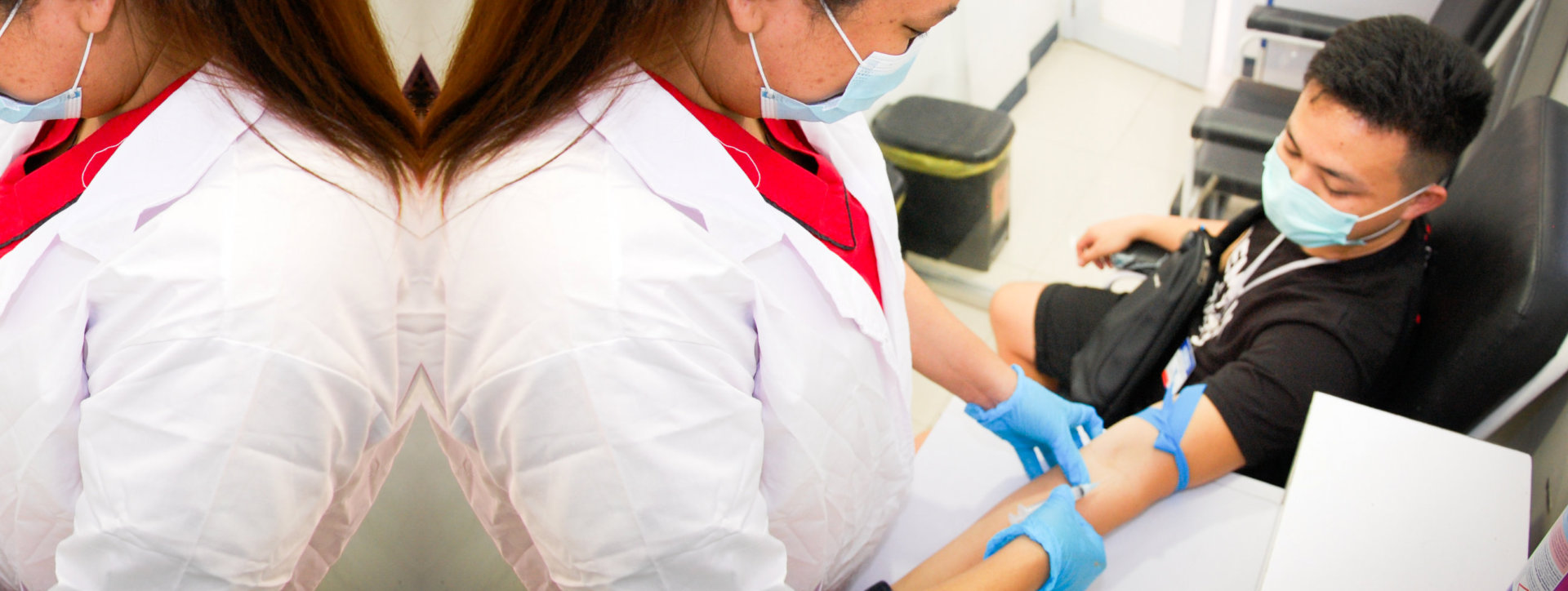 nurse taking blood of the patient