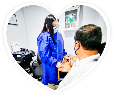 A women measuring blood pressure of an adult men