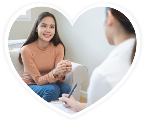 Mental health counselor. Young woman during therapy session talking with a psychologist in the office.